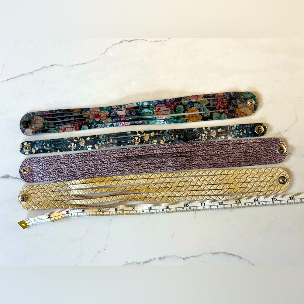Bundle of four S Flourish Leather double wrap bracelets. Metallic, Floral